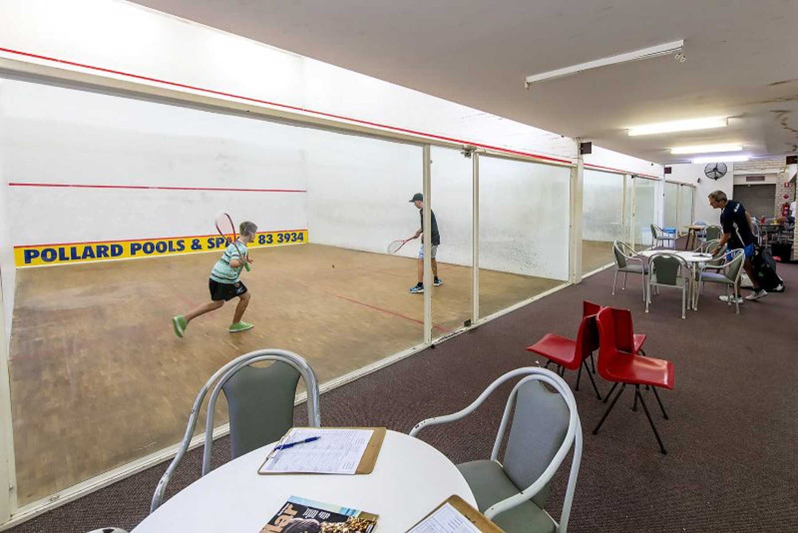 Junior squash players on court — Phase 2 launches the juniors program
